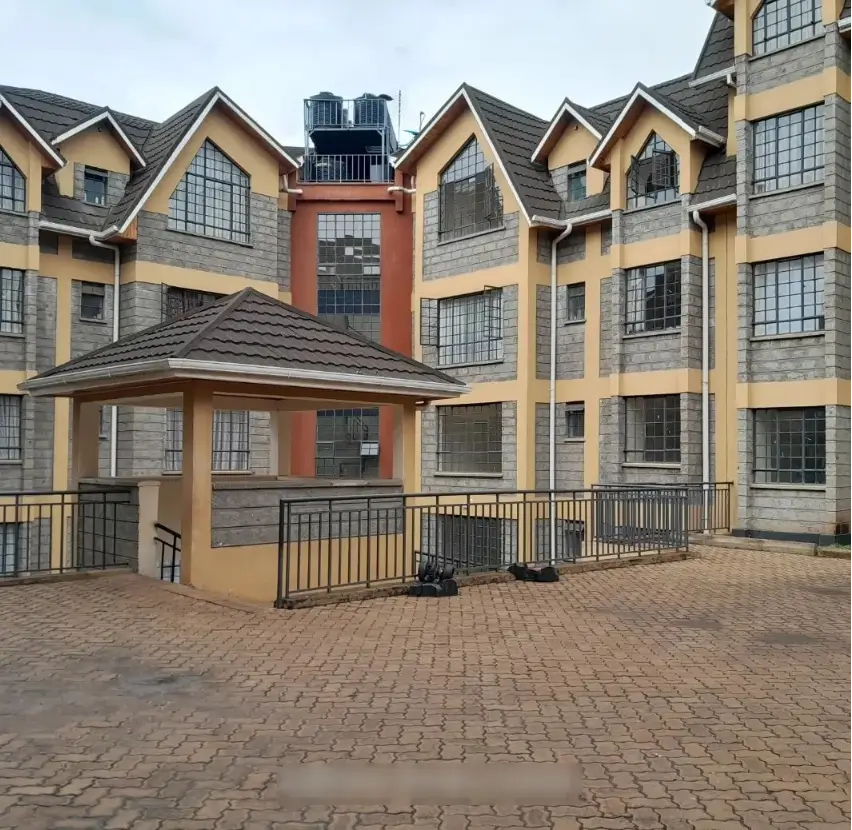 Multi-story residential complex with brick and stone facade
