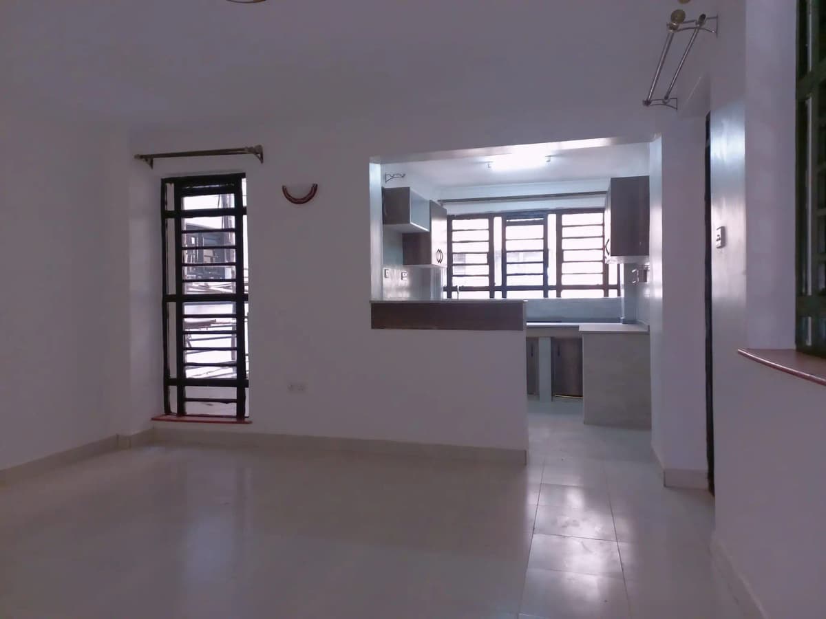 Spacious open living area with polished concrete flooring