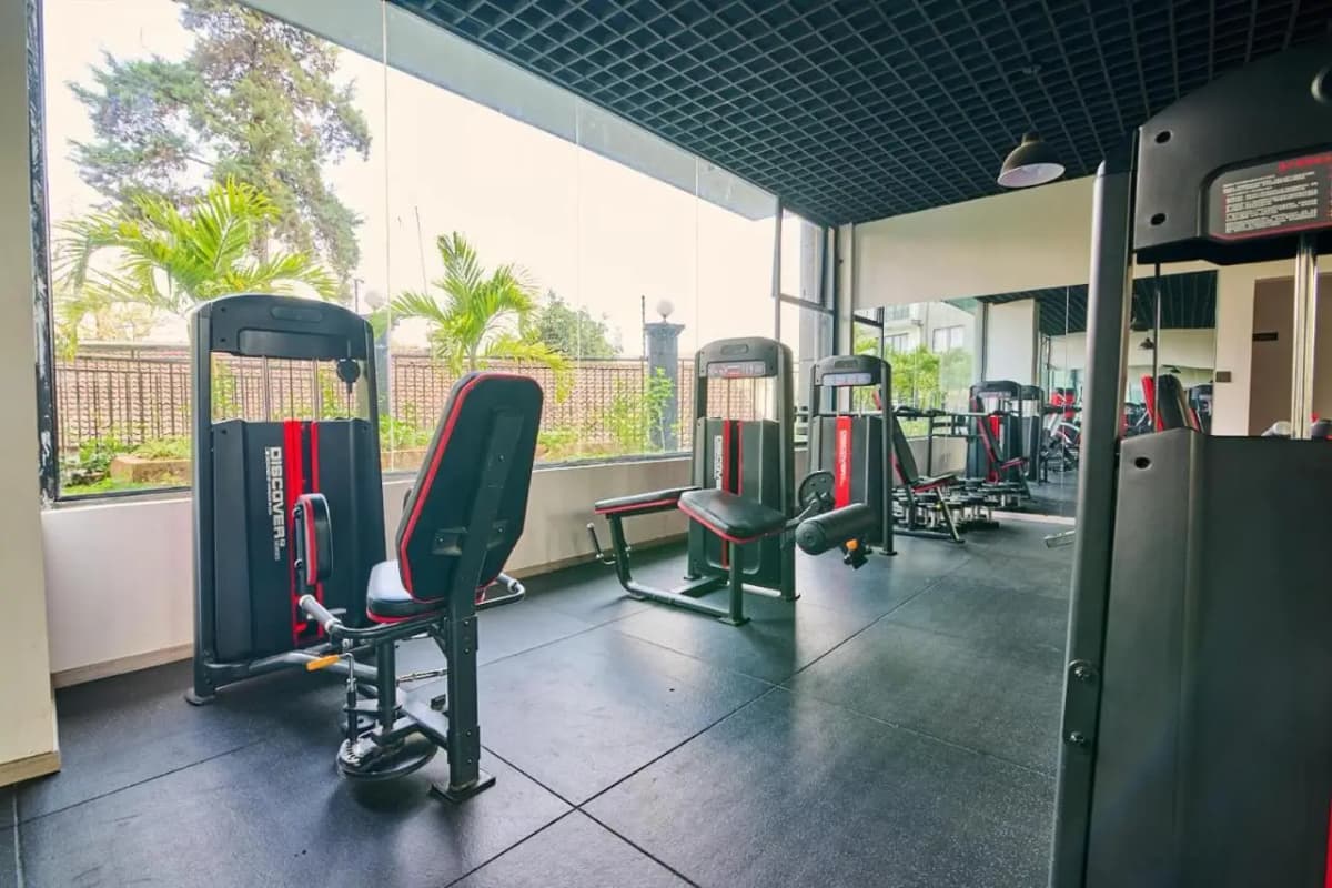 Spacious gym with multiple cardio and strength training equipment