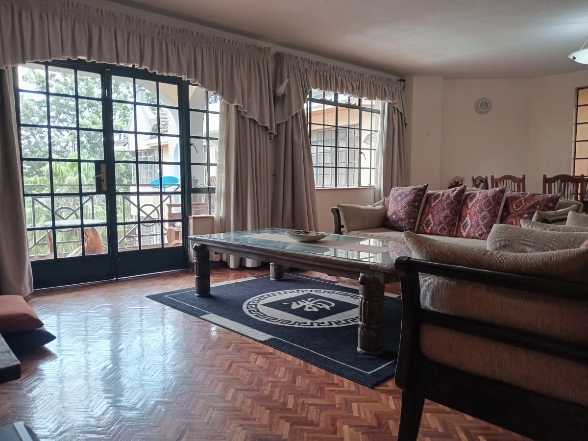Spacious living room with patio doors overlooking garden