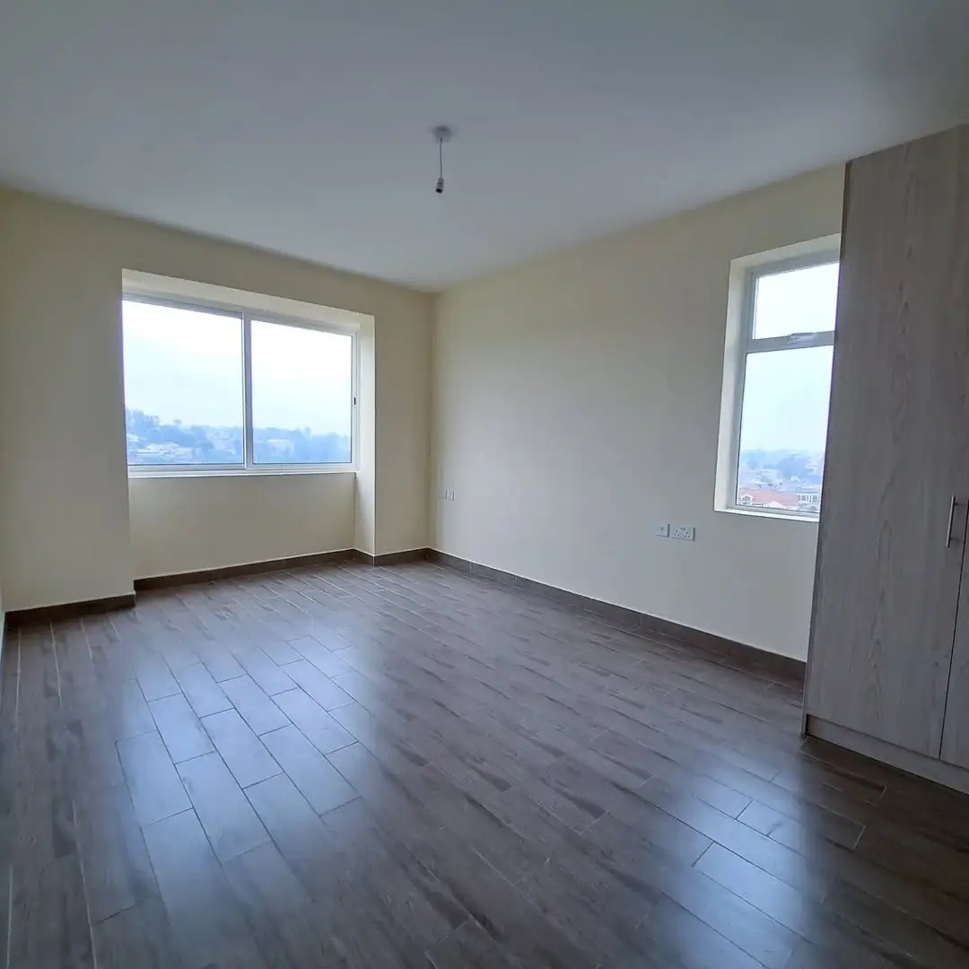 Spacious bedroom with panoramic city and mountain views
