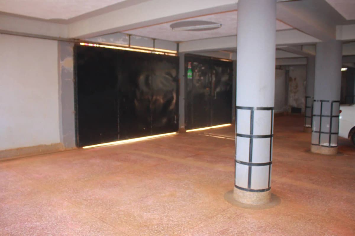 Spacious lobby with polished terracotta floor and support columns
