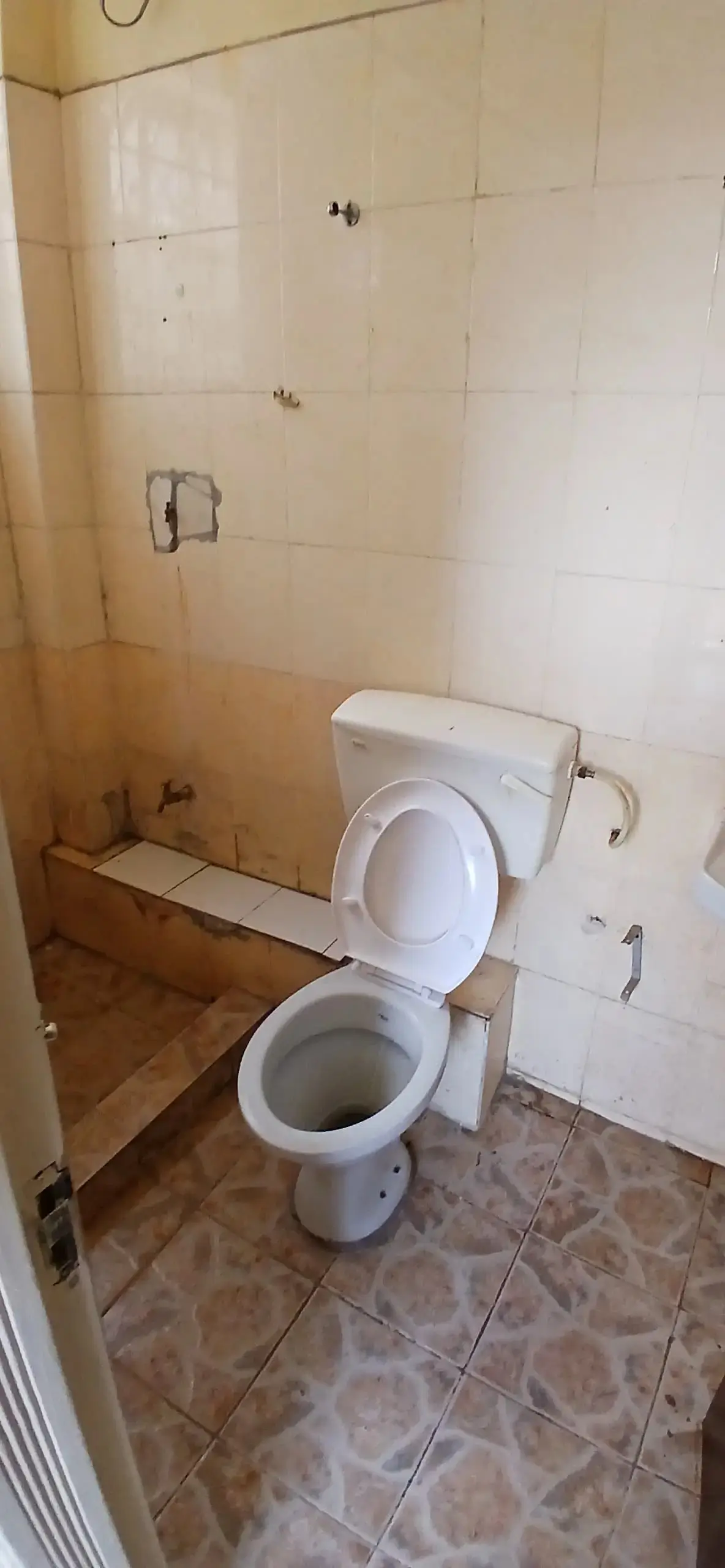 Basic bathroom with toilet and shower enclosure