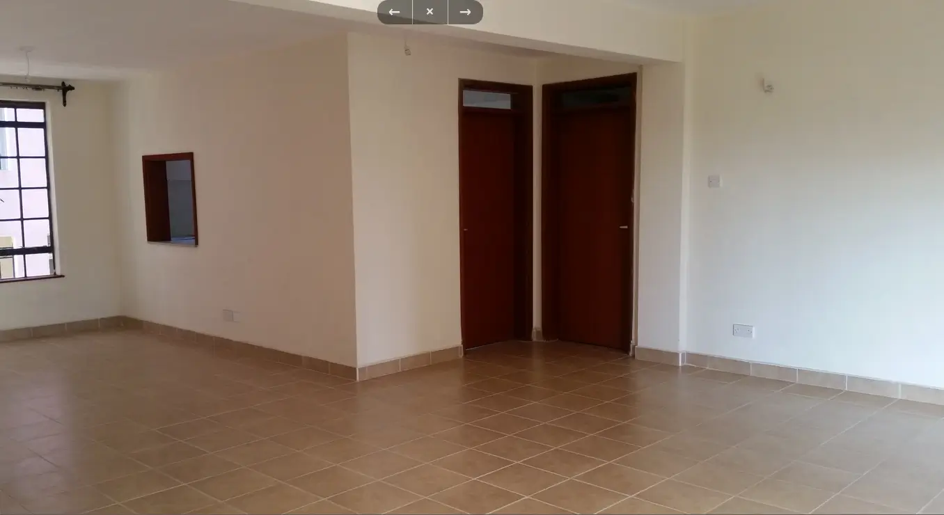 Spacious empty living room with terracotta tile flooring