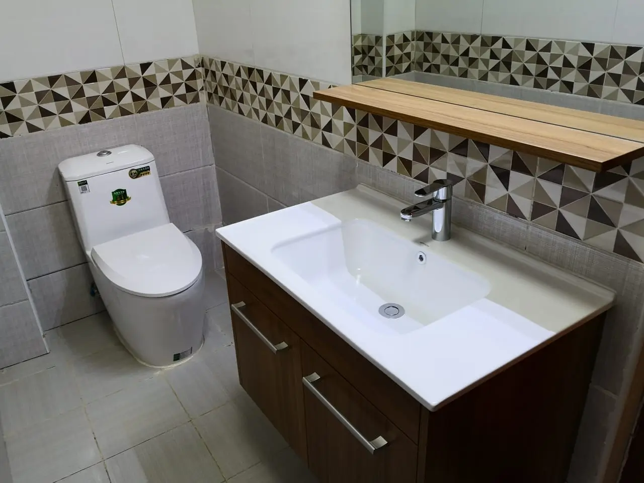 Modern bathroom with dual vanity sink and toilet