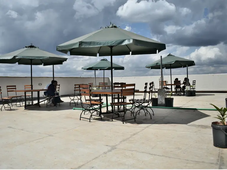 Rooftop terrace with umbrellas and outdoor seating area