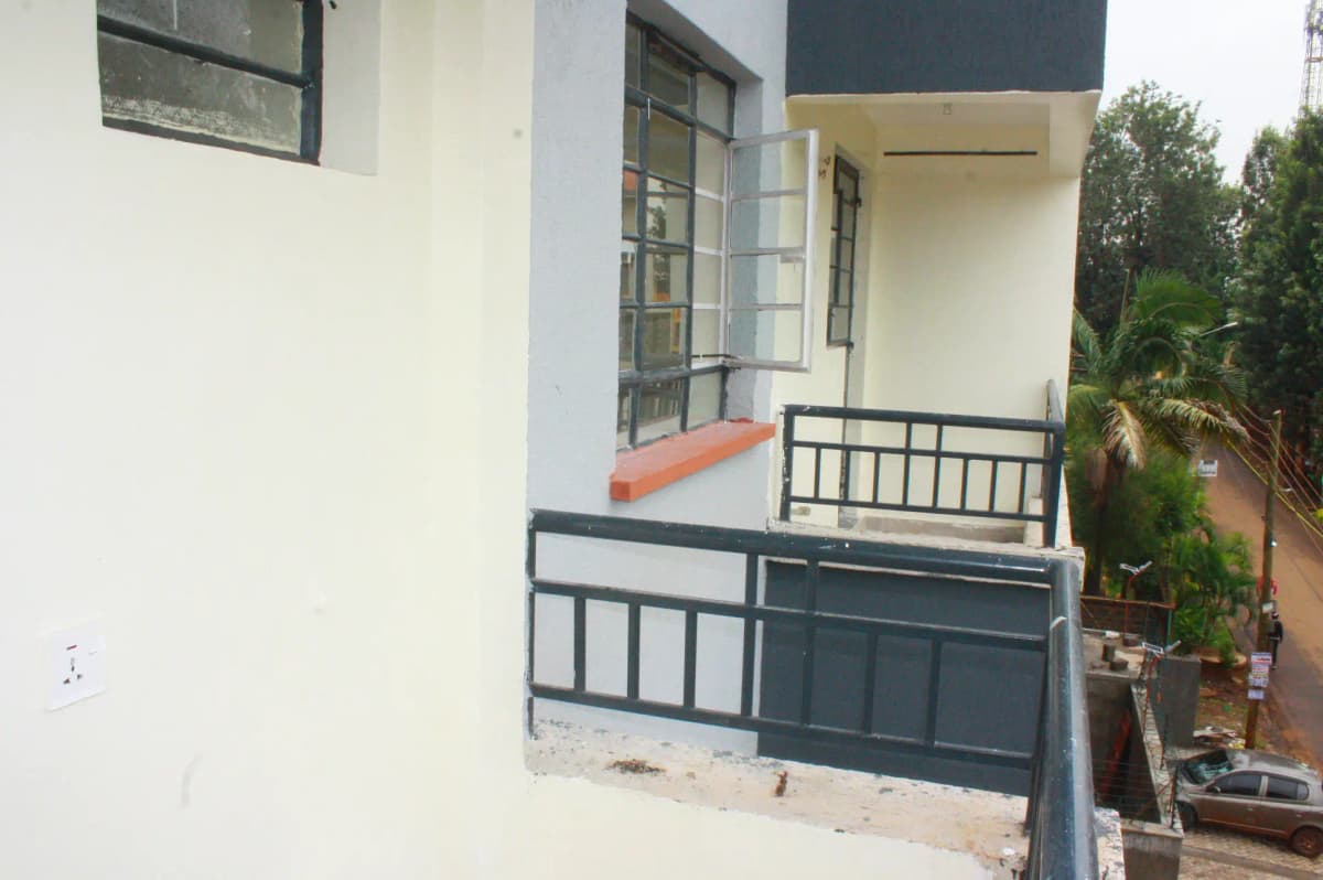 Modern house facade with covered porch and metal railings