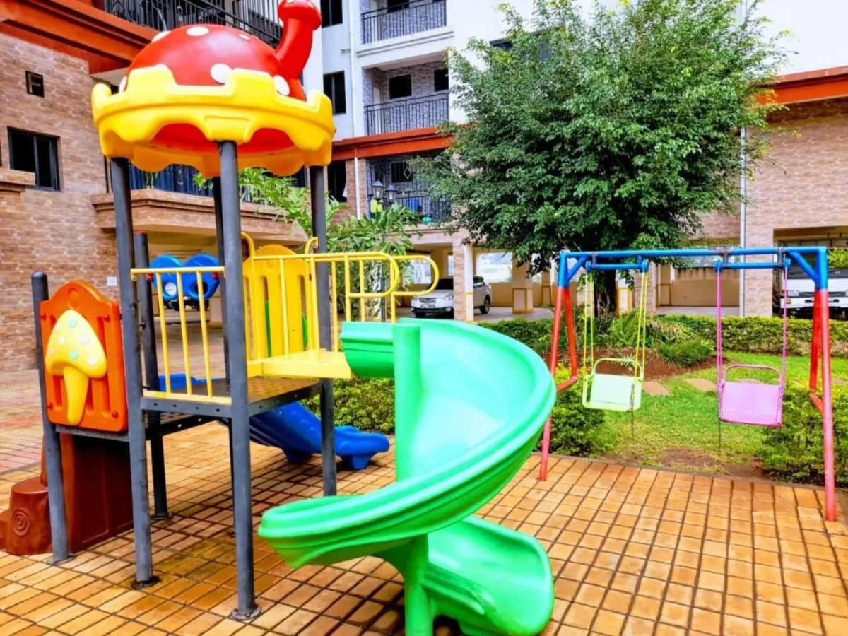 Colorful children's playground in residential compound grounds