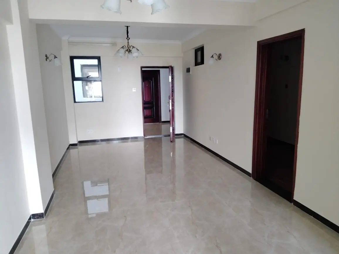 Spacious empty living room with polished marble flooring