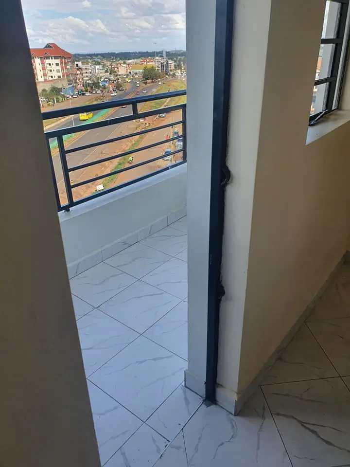 Balcony with city skyline views and metal railings