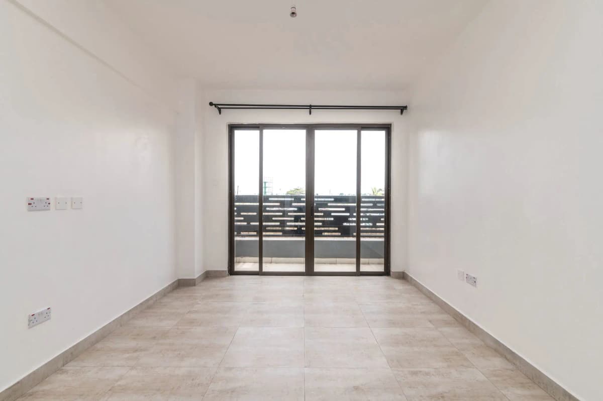 Empty balcony with glass sliding doors and railing view