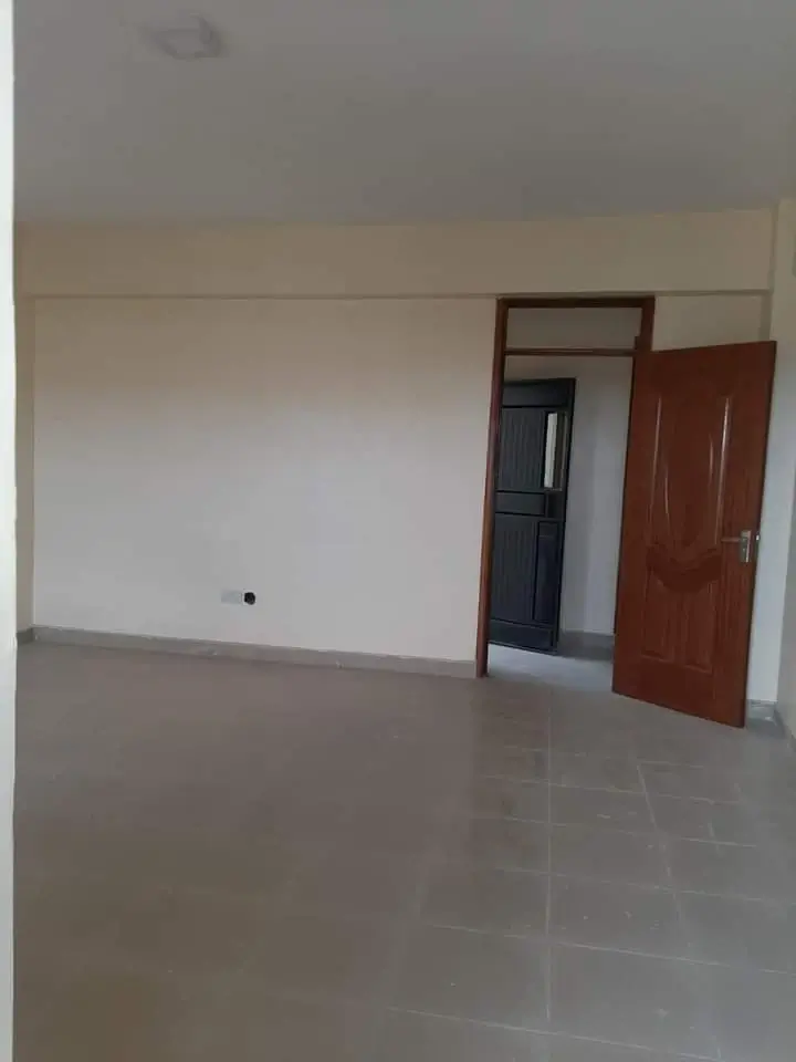 Spacious empty living room with polished concrete flooring