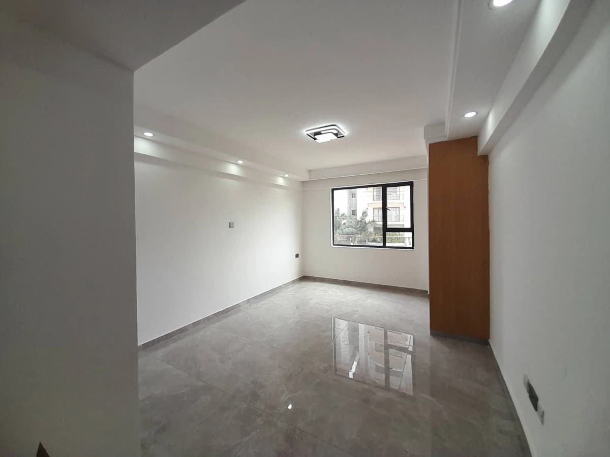 Bright empty living space with polished concrete flooring