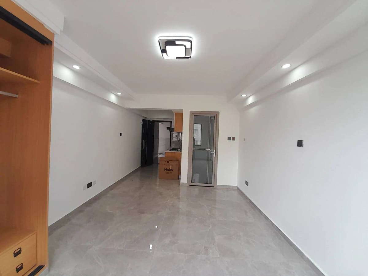 Bright modern corridor with polished concrete floor and recessed lighting