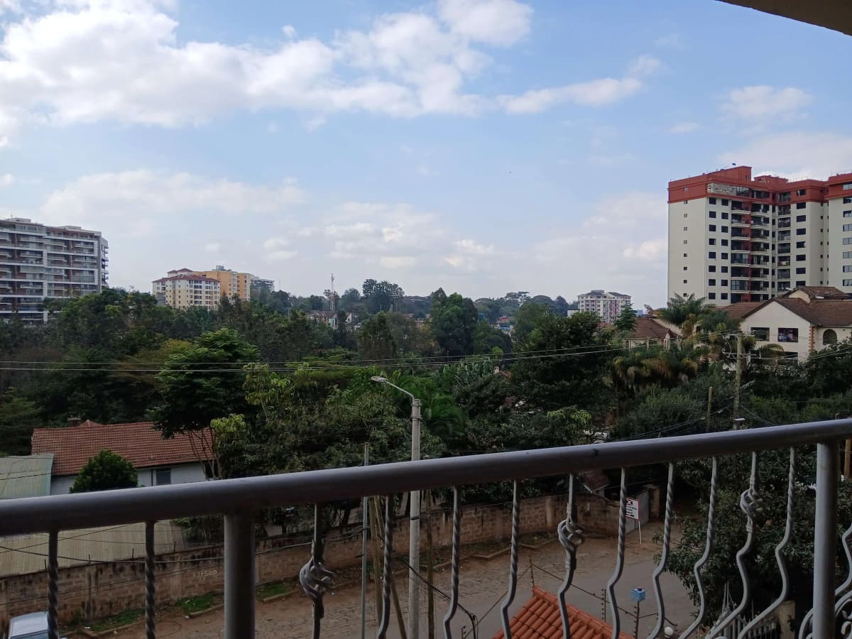 Balcony view overlooking residential neighbourhood with apartment buildings