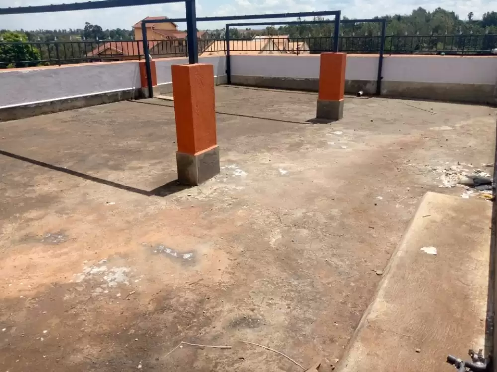 Rooftop terrace with structural pillars and perimeter railing