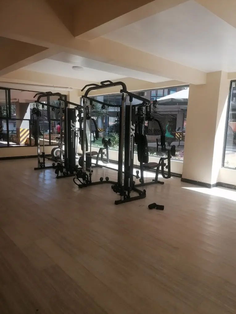 Multi-station gym equipment in spacious indoor fitness area