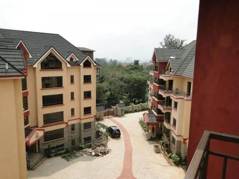 Residential compound with multi-story buildings and shared driveway