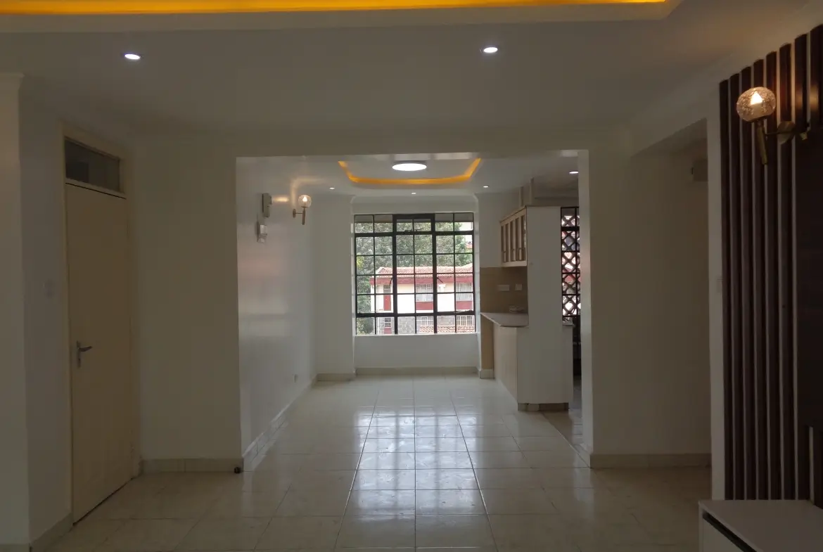 Bright open lobby with tiled flooring and modern lighting