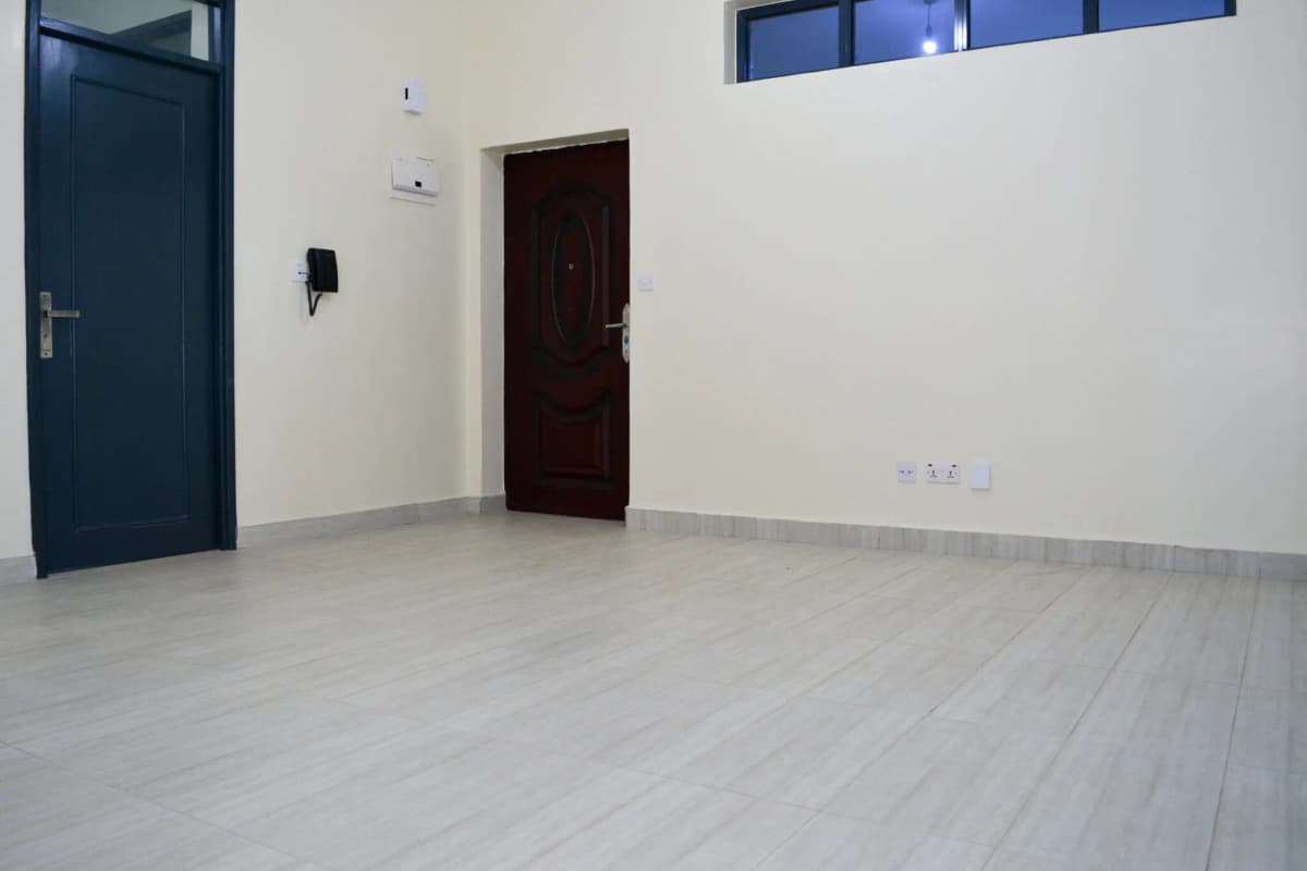Spacious empty living room with polished concrete flooring