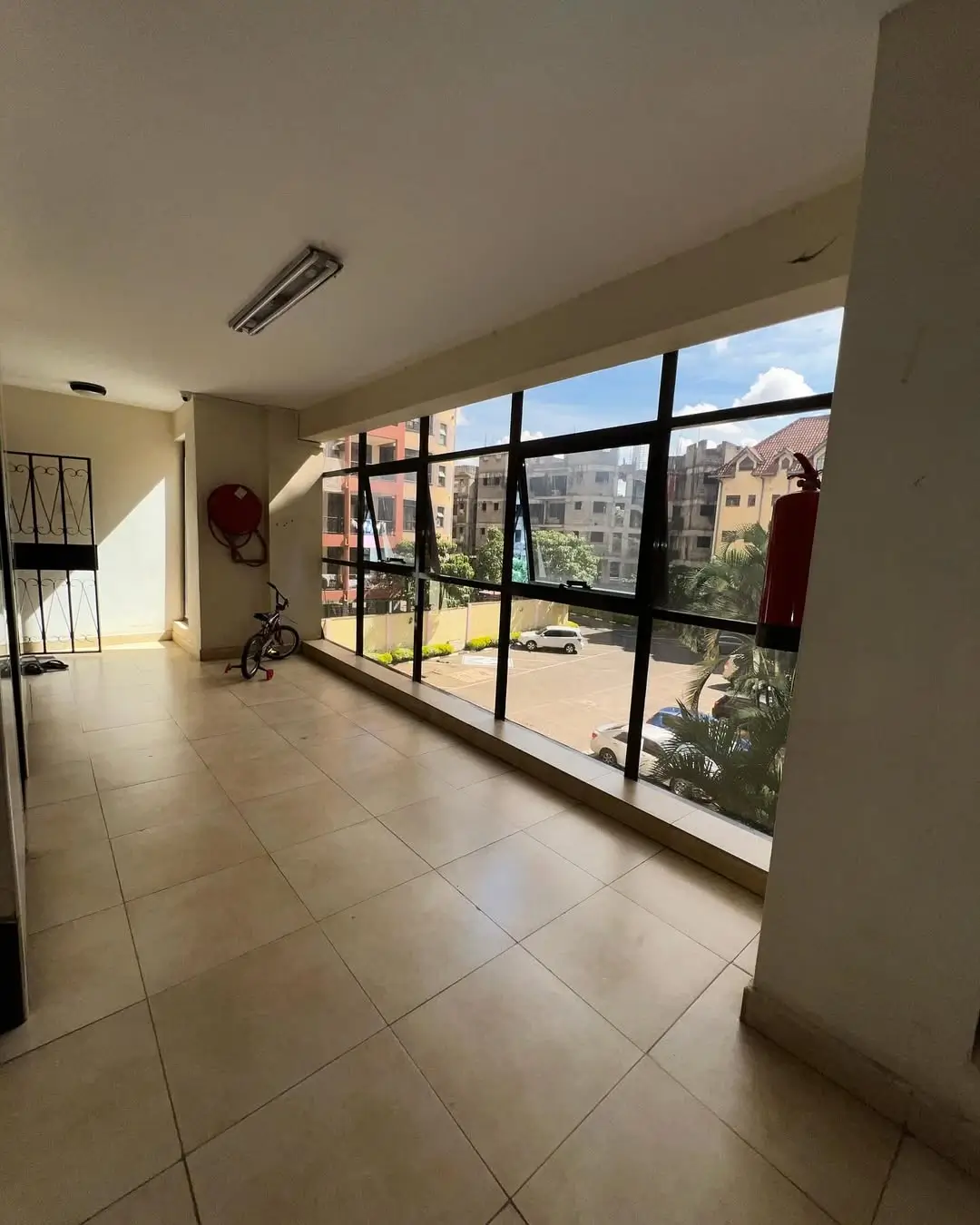 Spacious covered balcony with panoramic city views and natural light