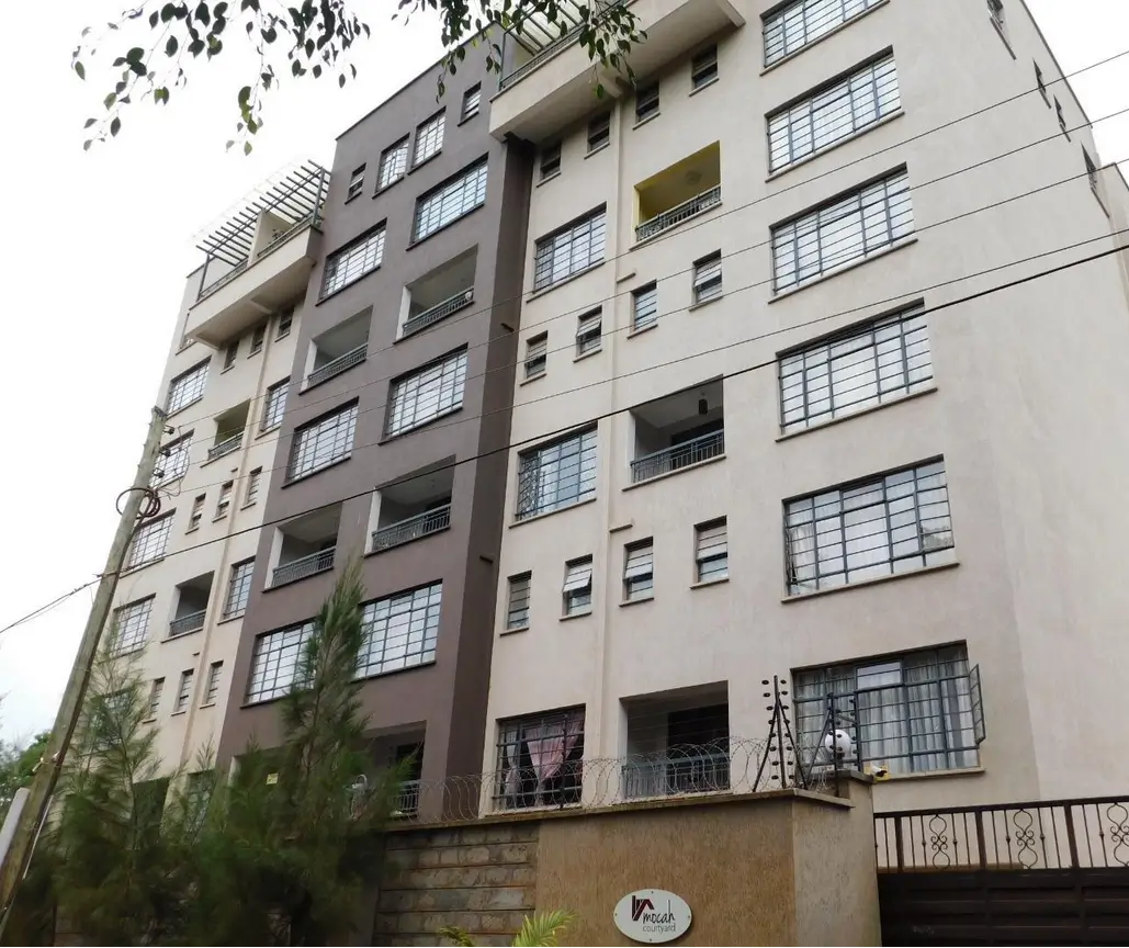 Multi-story residential apartment building facade with balconies