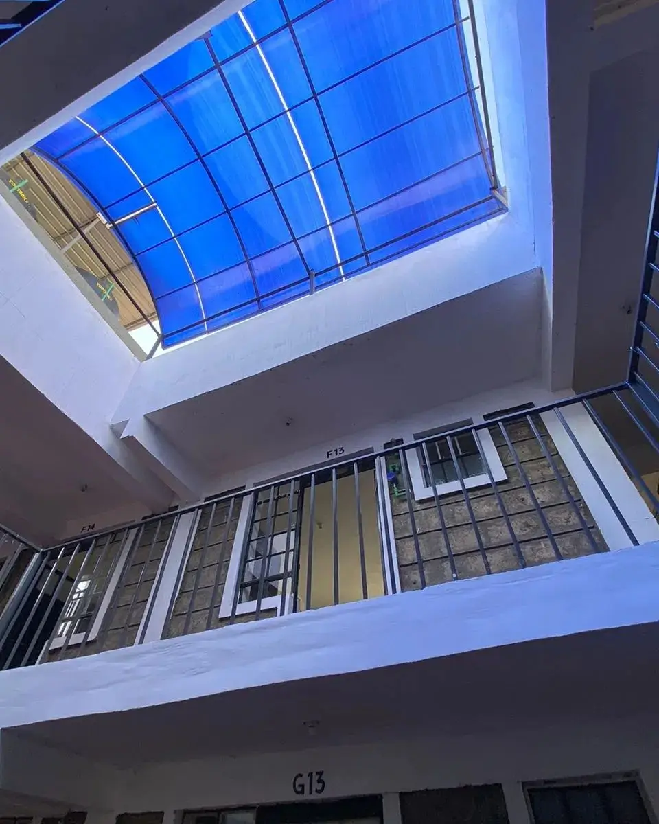 Multi-story atrium with blue skylight and staircase