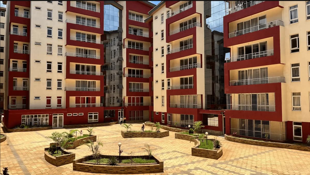 Central courtyard garden with landscaped planters and paved compound