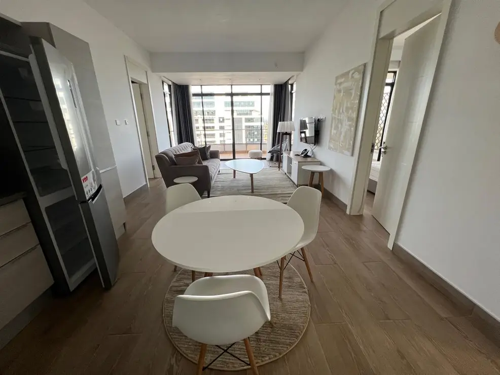 Open-plan living and dining with floor-to-ceiling windows
