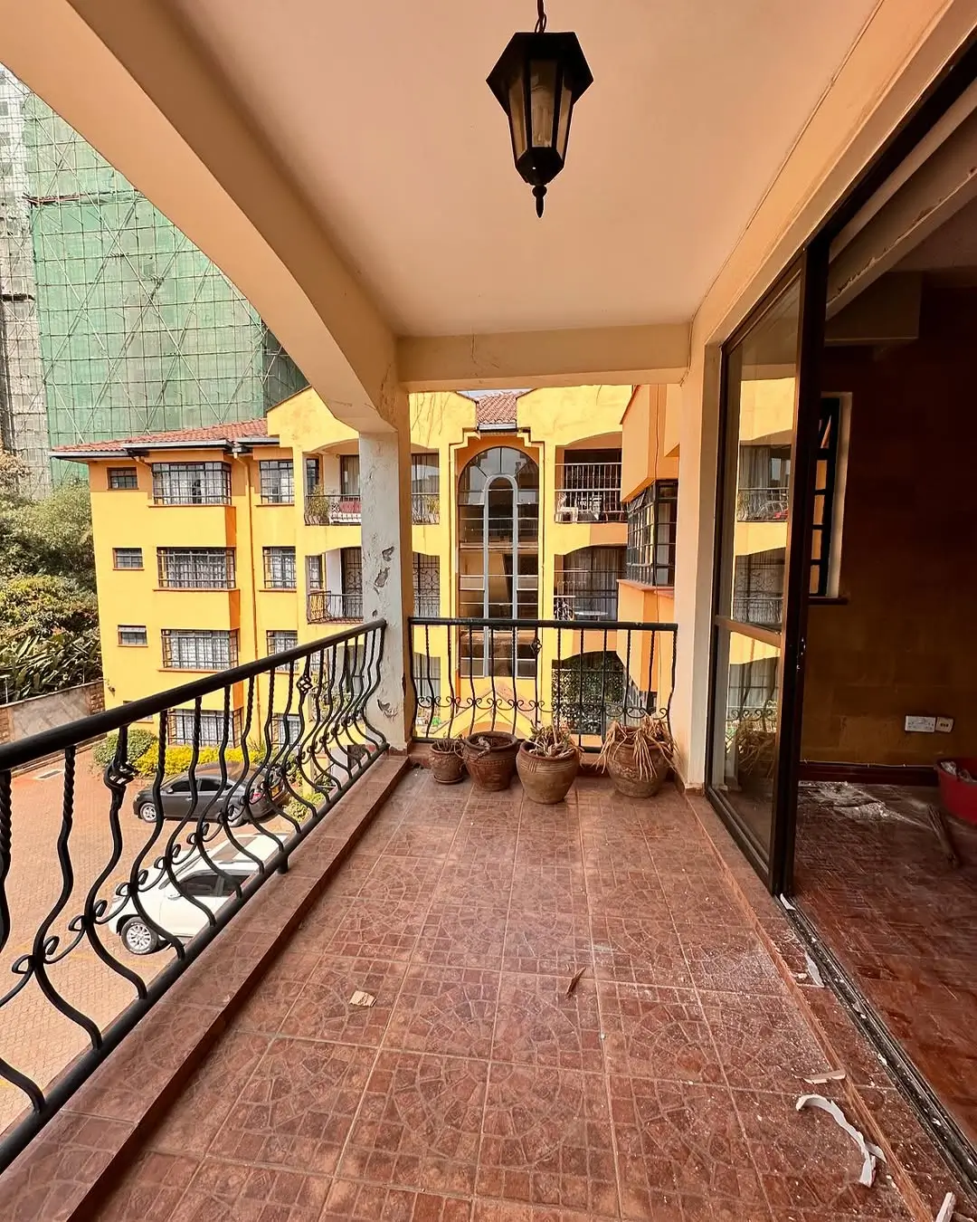 Spacious balcony with city views and decorative railing