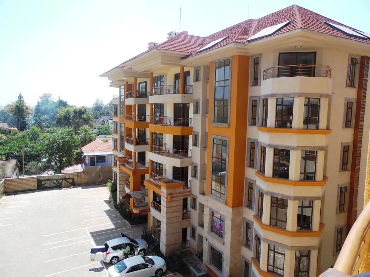 Multi-story residential building with yellow and orange facade