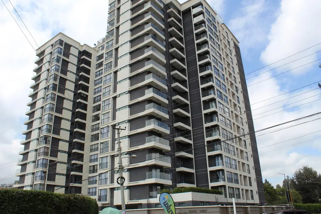 Modern multi-story residential building facade with balconies