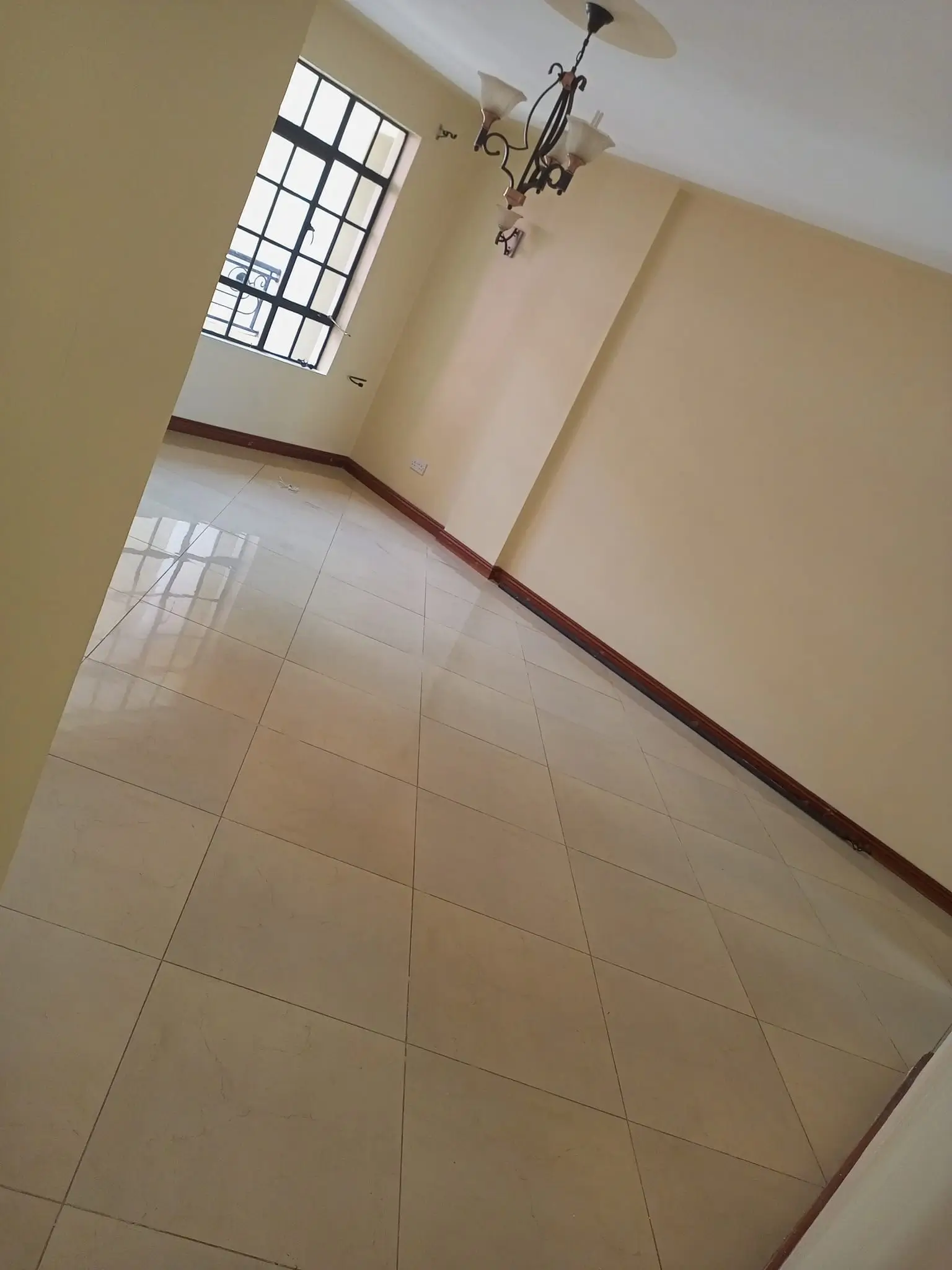 Bright hallway with tiled flooring and natural light from window