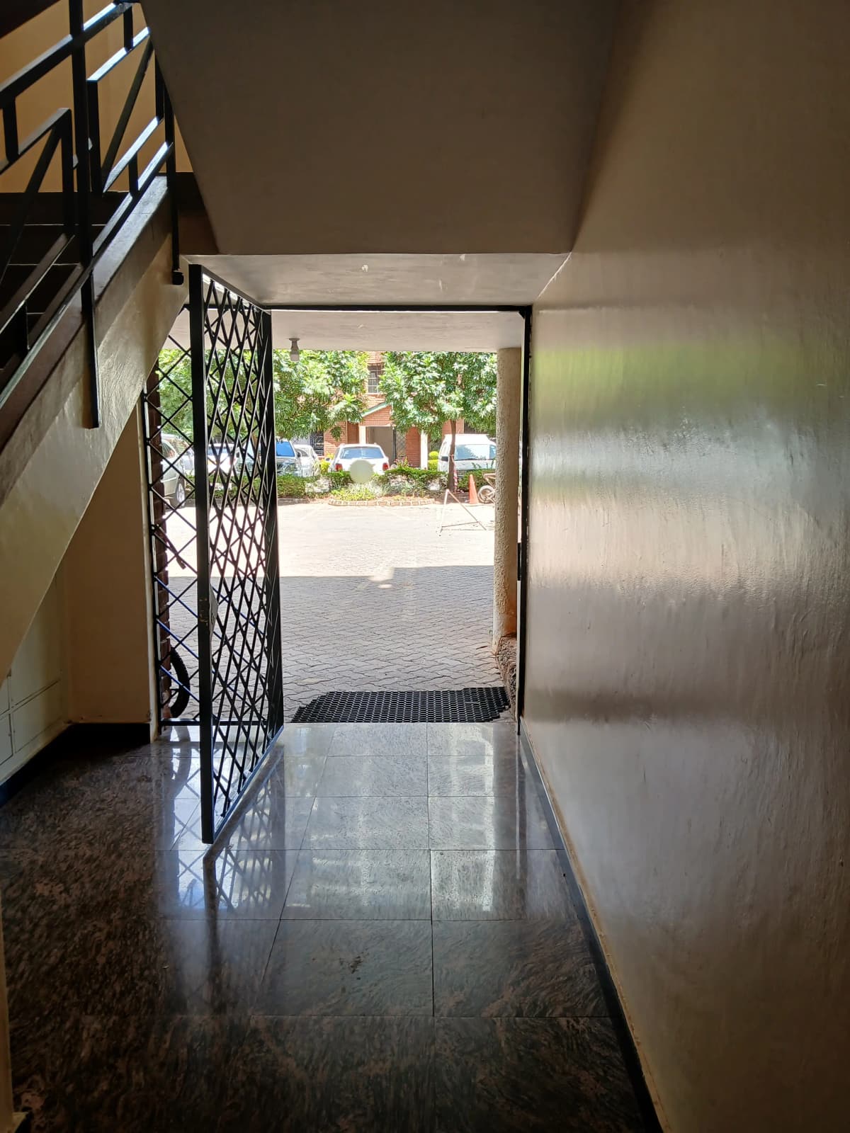 Building entry hall with decorative metal security gate