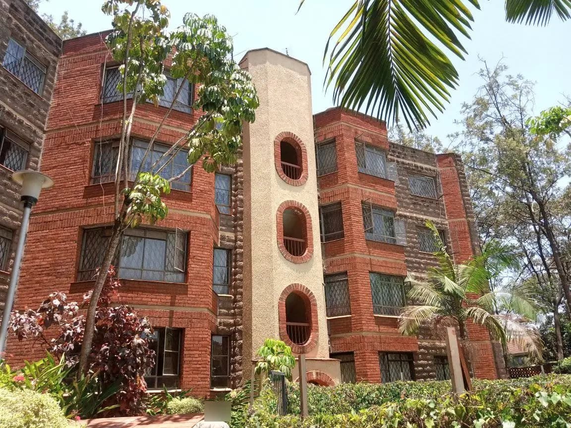 Red brick residential building with circular architectural features