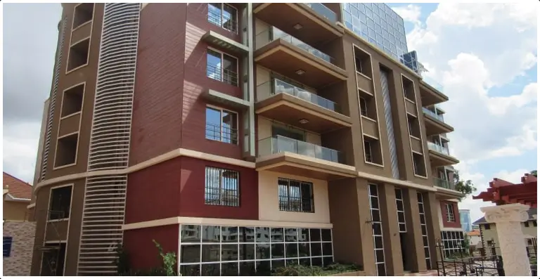 Modern multi-story residential building with red and brown facade