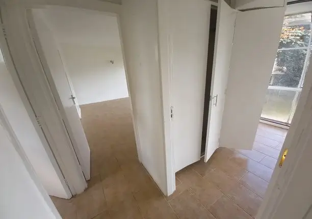 Bright corridor with multiple doorways and natural light