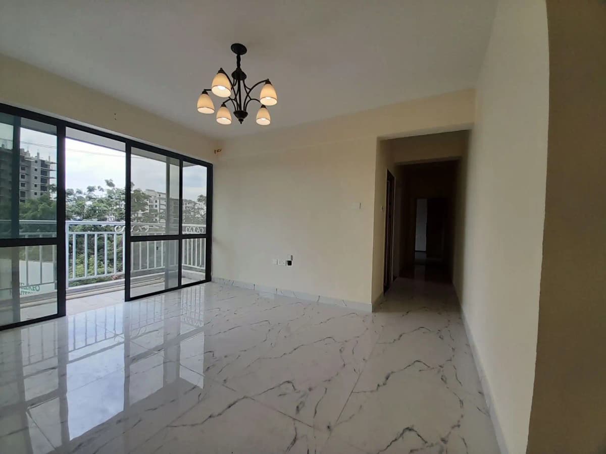 Spacious living room with marble flooring and city views