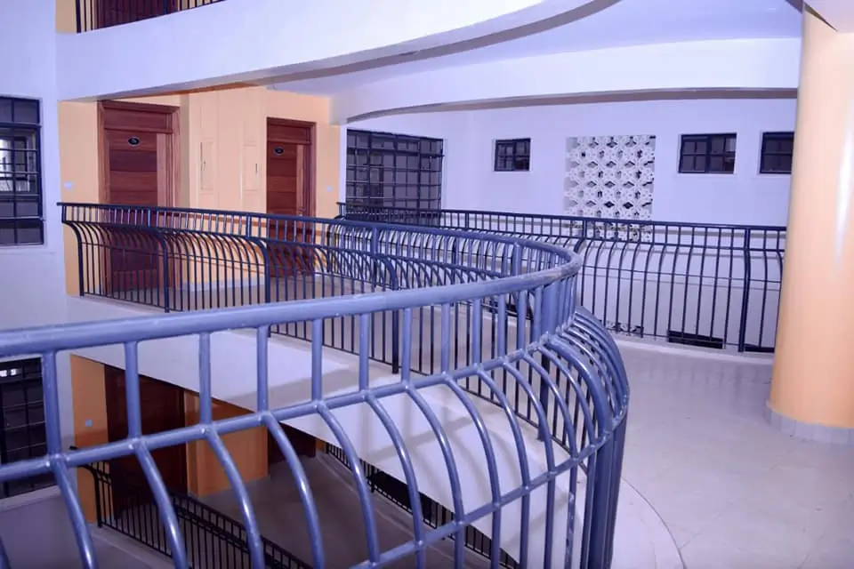 Multi-level lobby with curved railings and modern architecture