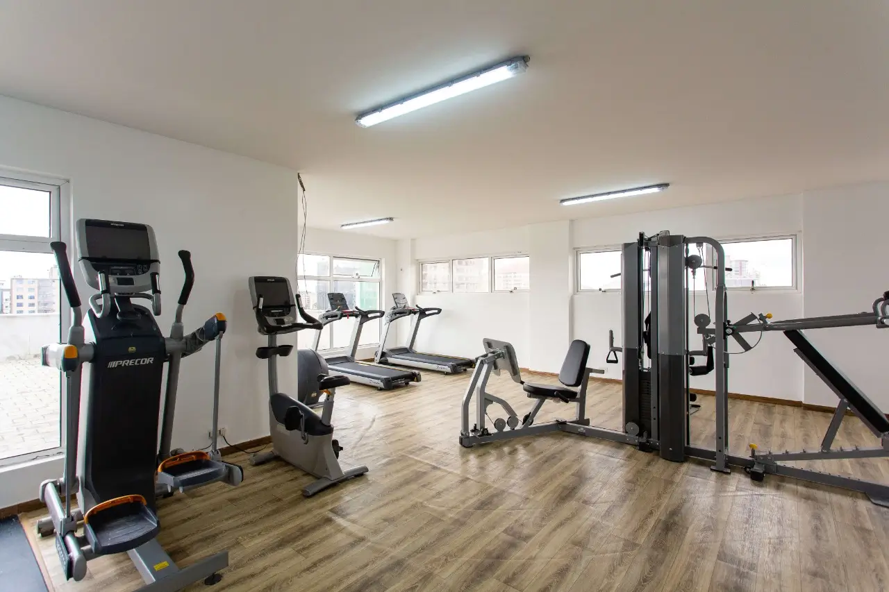 Spacious fitness room with cardio machines and strength equipment
