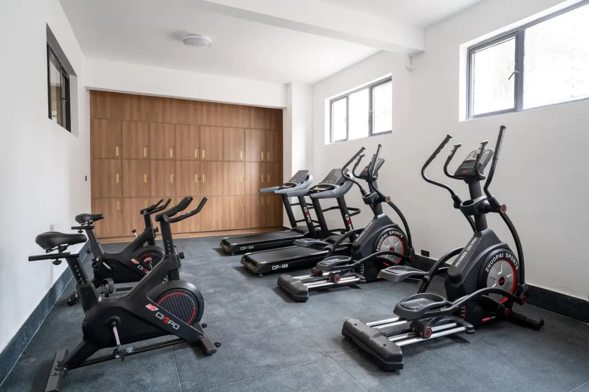 Modern gym with spinning bikes, treadmills, ellipticals