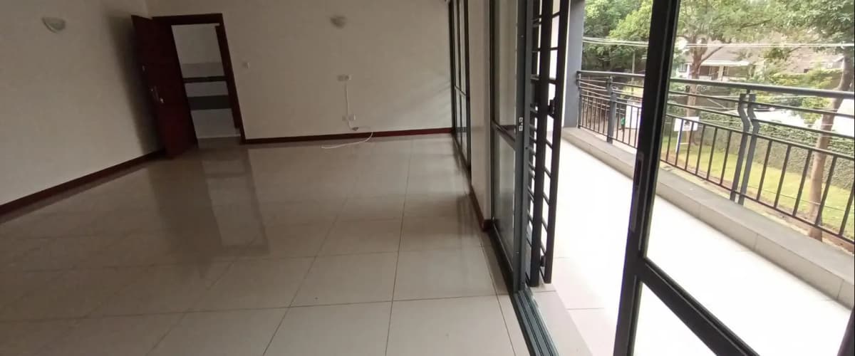 Spacious open-plan living area with access to balcony