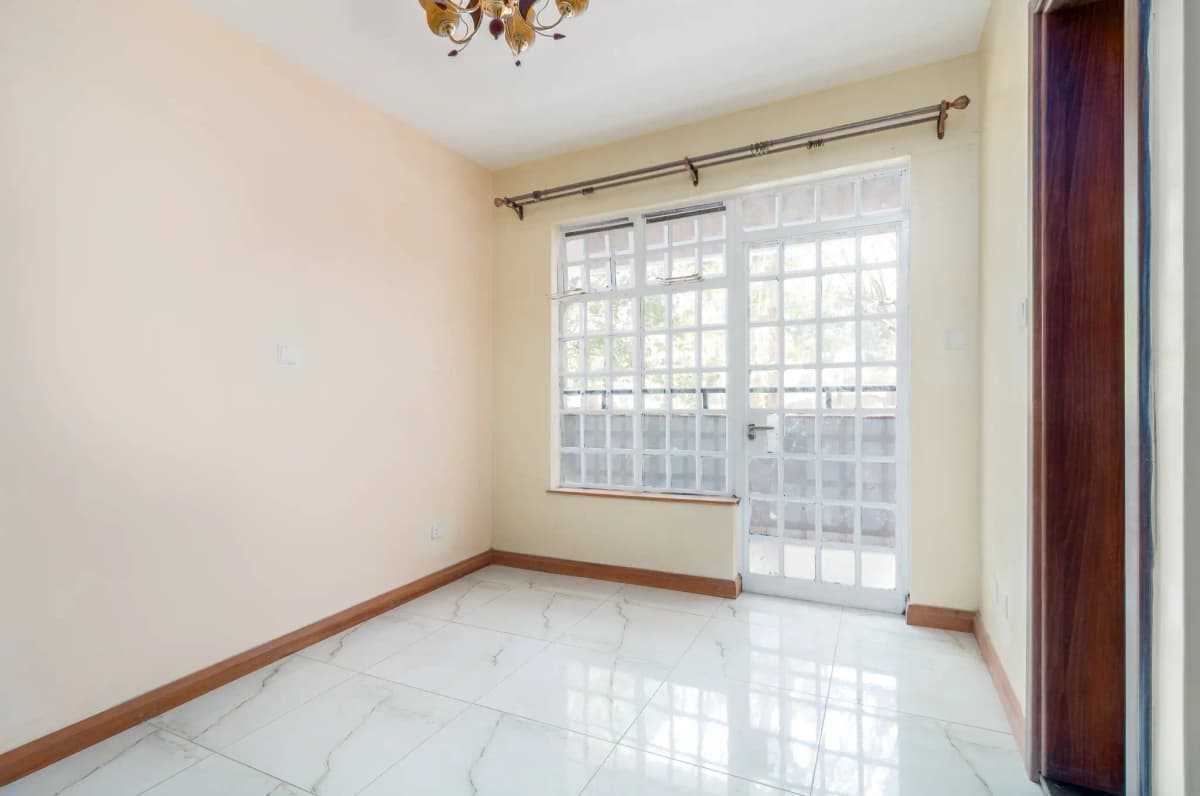 Bright balcony with glass sliding doors and polished tile flooring