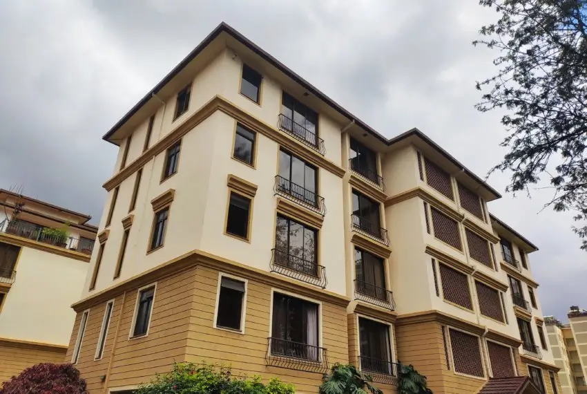 Multi-story residential building with cream and wood facade