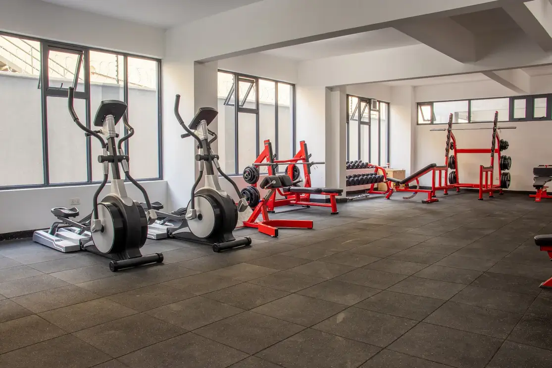 Modern fitness facility with cardio machines and strength training equipment