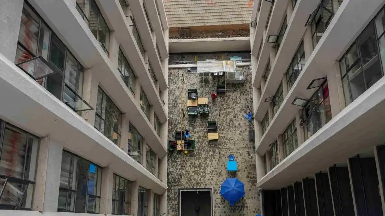 Multi-story building courtyard with central communal gathering space