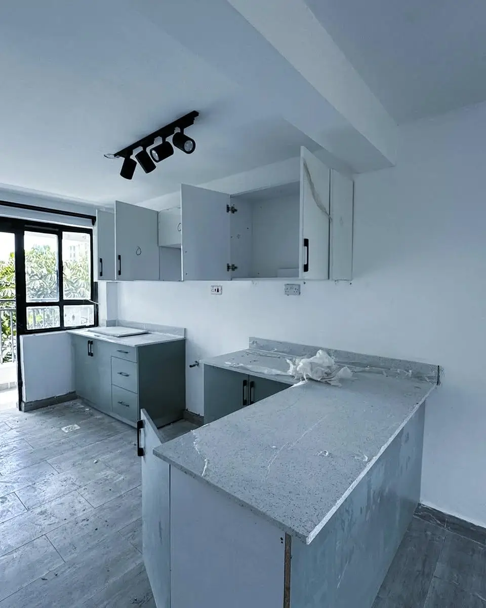 Modern kitchen with gray countertops and island cabinetry