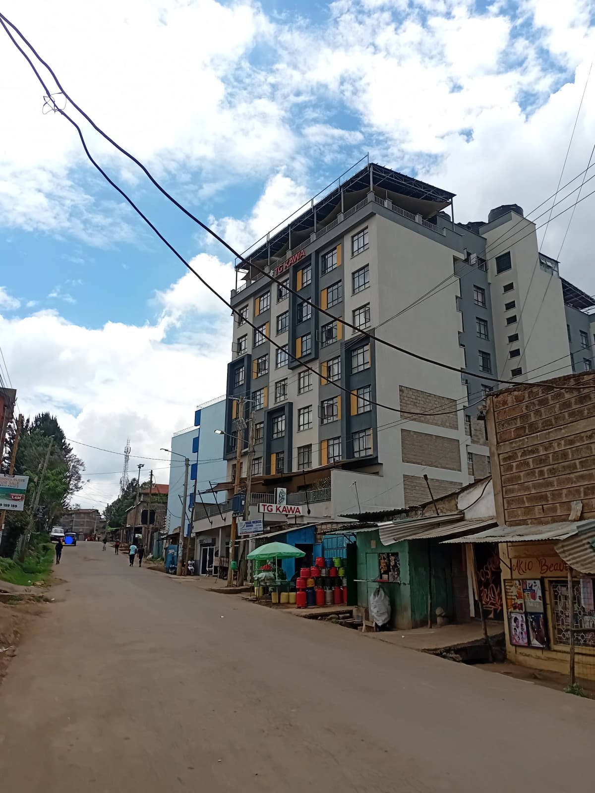 Multi-story residential building with street-level shops