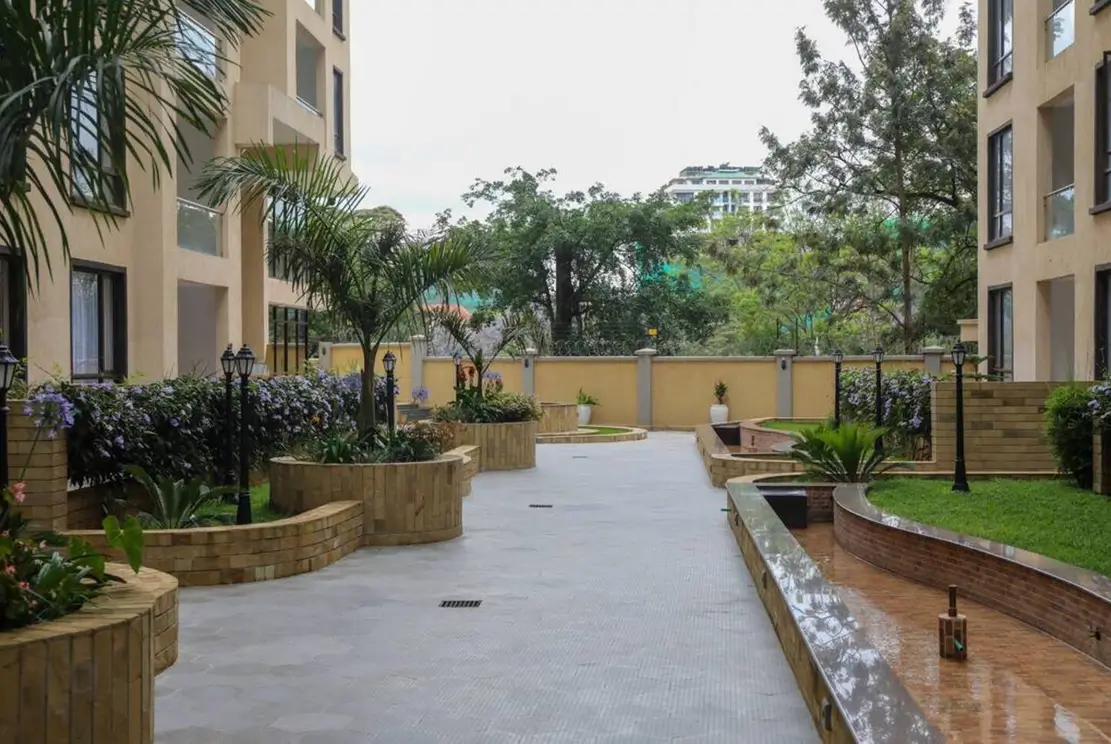 Landscaped compound courtyard with planted beds and pathways