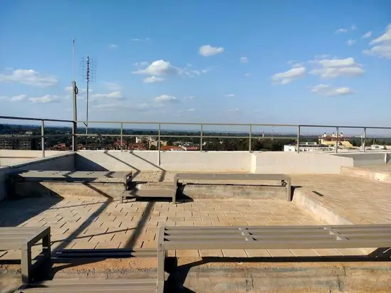 Rooftop terrace with panoramic city and landscape views